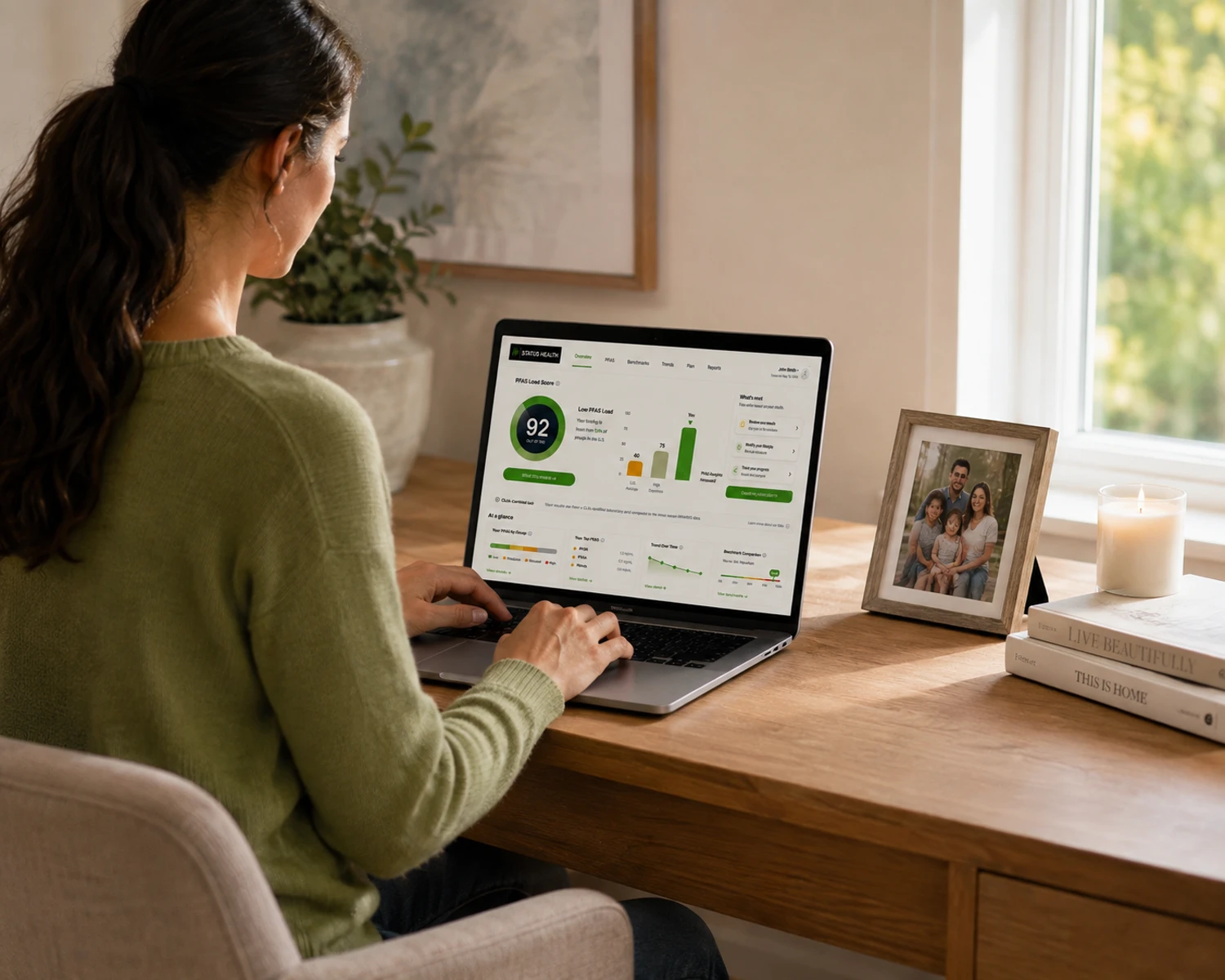 A person reviewing their Status Health dashboard on a laptop at home